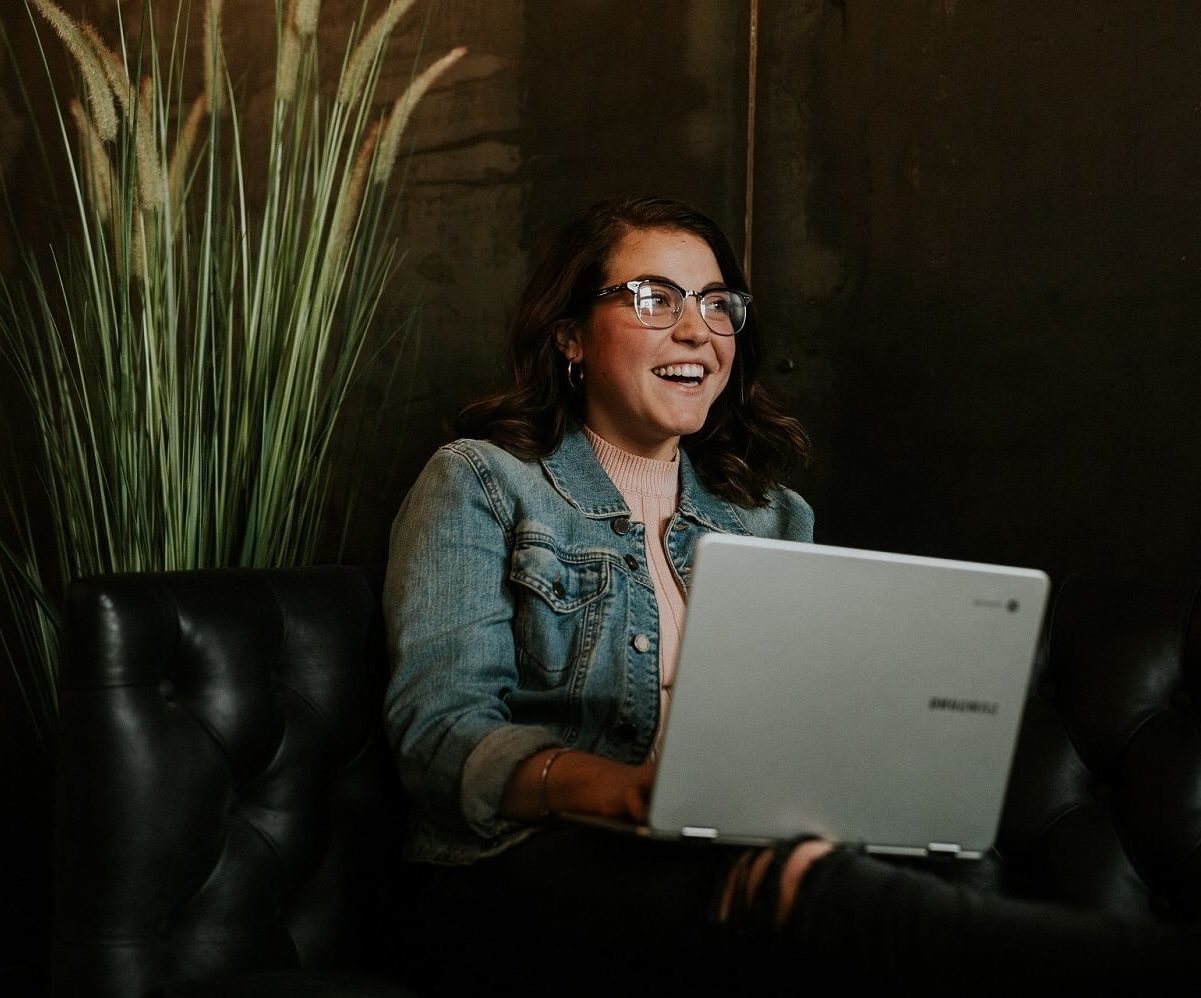 seated woman with laptop